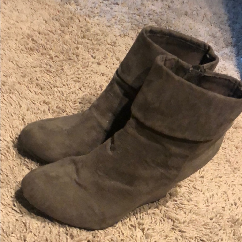 Woman’s grey suede wedge booties